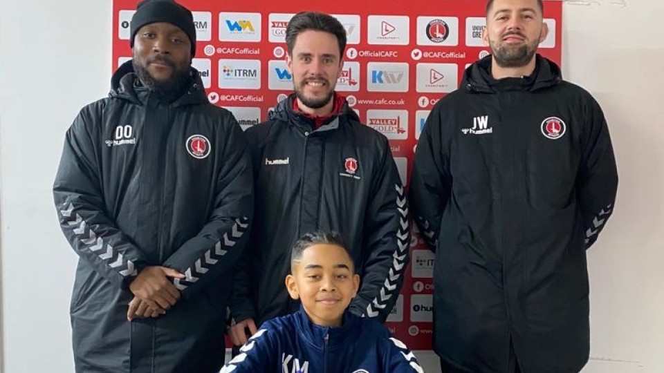 Kyan May signing his contract with CAFC and CACT staff