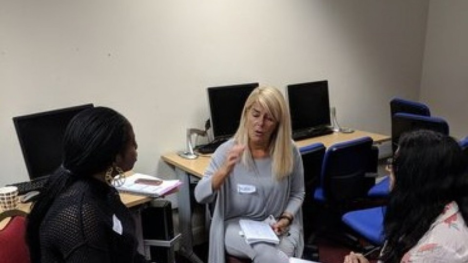 A group of people in a computer suite