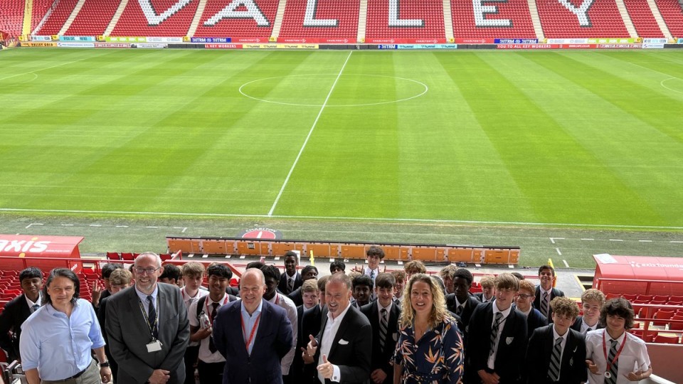 Group photo at The Valley with Norton Knatchbull students and members of the Charlton family