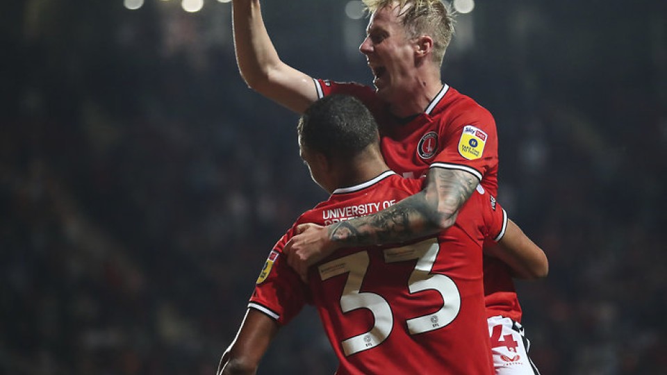 Charlie Kirk celebrates with Miles Leaburn