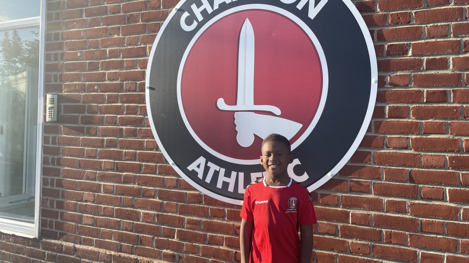 Niall in front of Charlton Athletic badge
