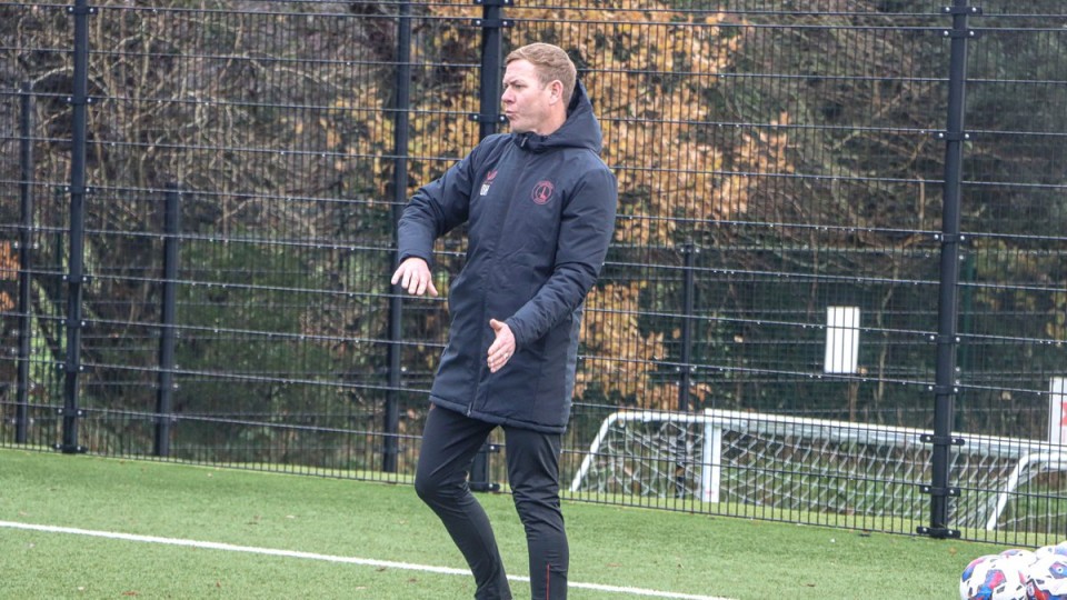 Dean Holden coaching in Charlton kit