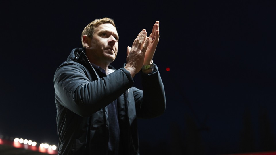 Dean Holden claps supporters