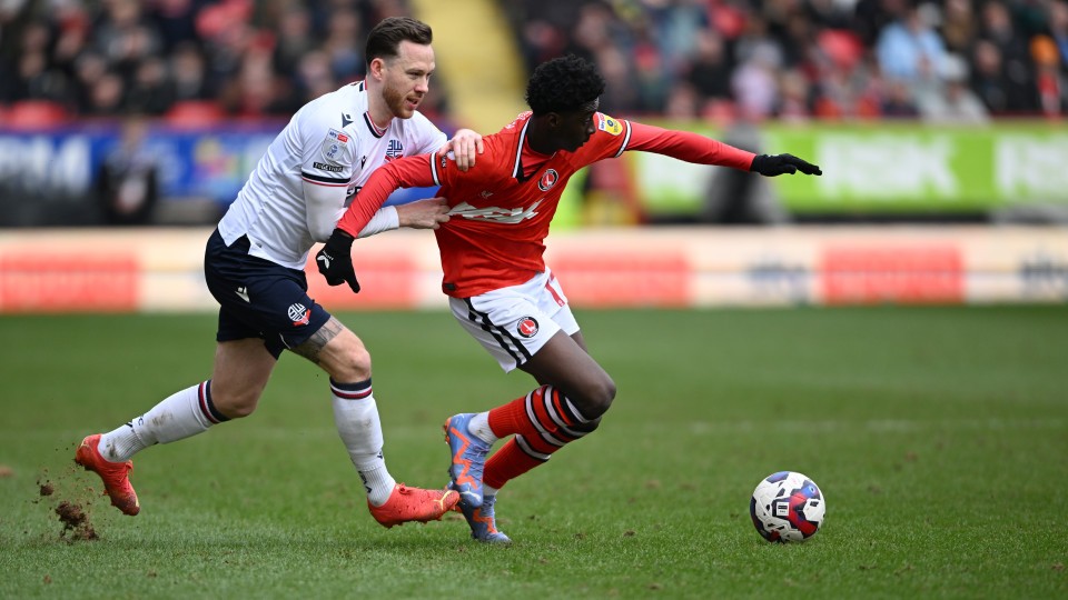 Jes Rak-Sakyi battles for possession