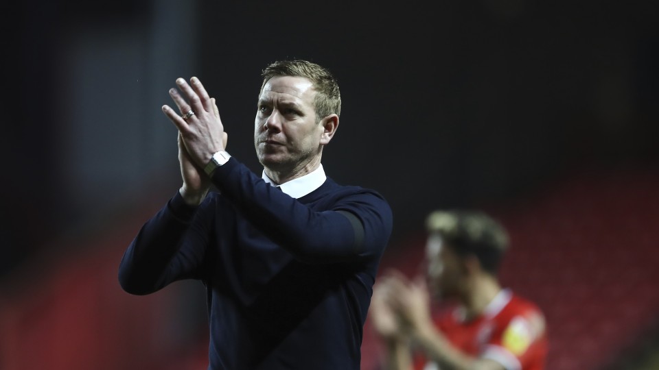 Dean Holden claps supporters