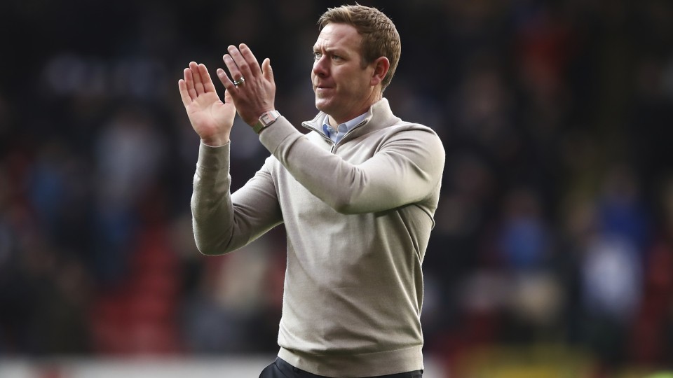 Dean Holden claps supporters