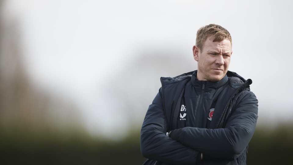 Dean Holden watching training