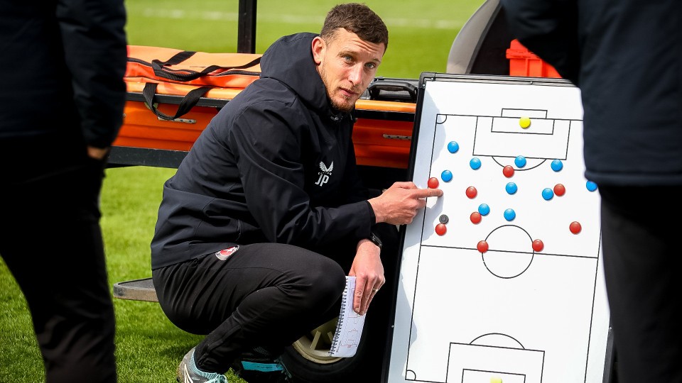 Jason Pearce with a tactics board