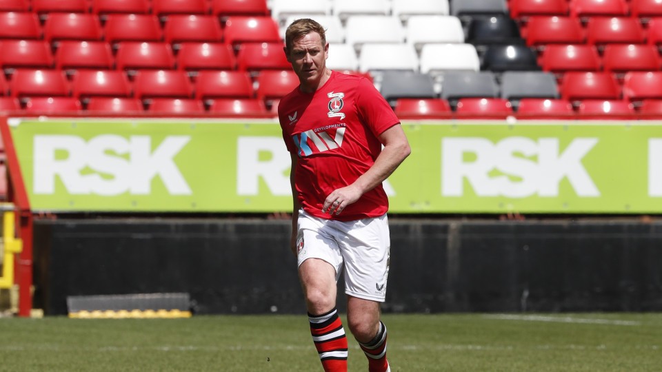 Dean Holden passes the ball