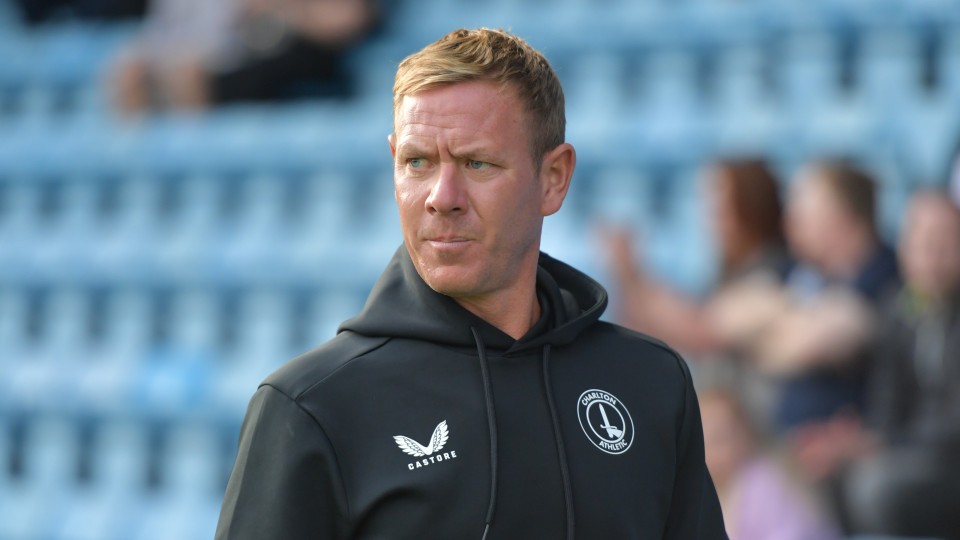 Dean Holden looks on