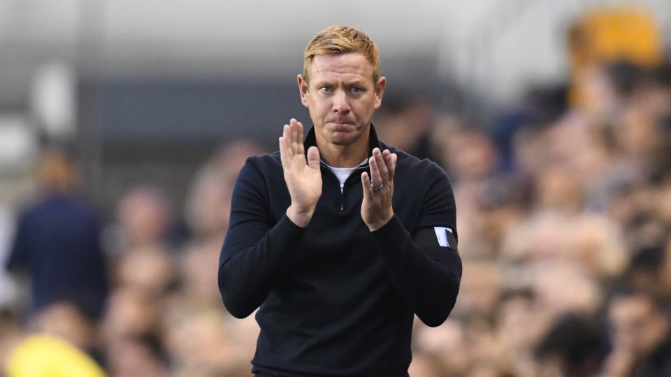 Dean Holden claps his team on