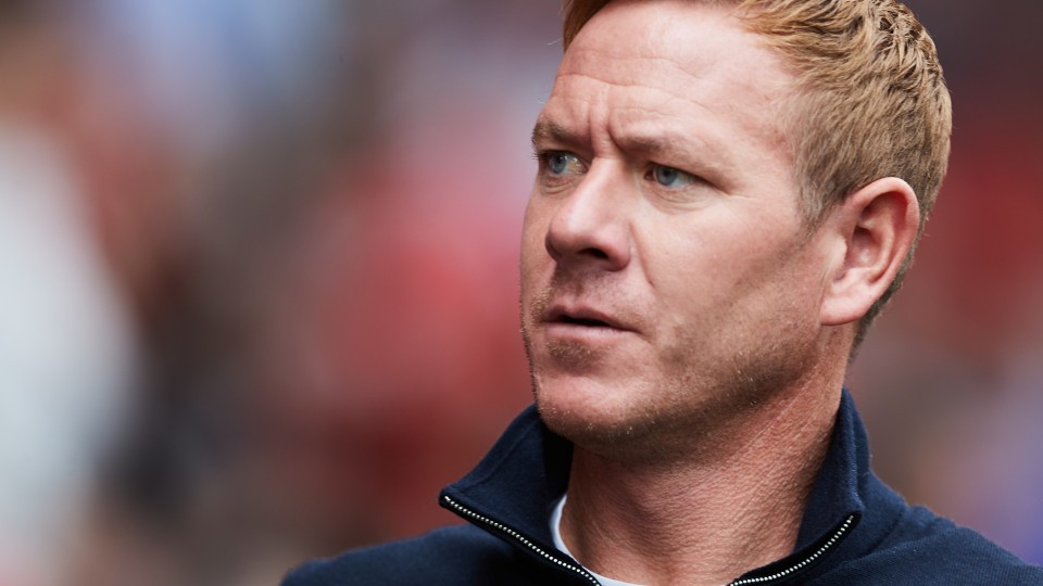 Dean Holden looks on