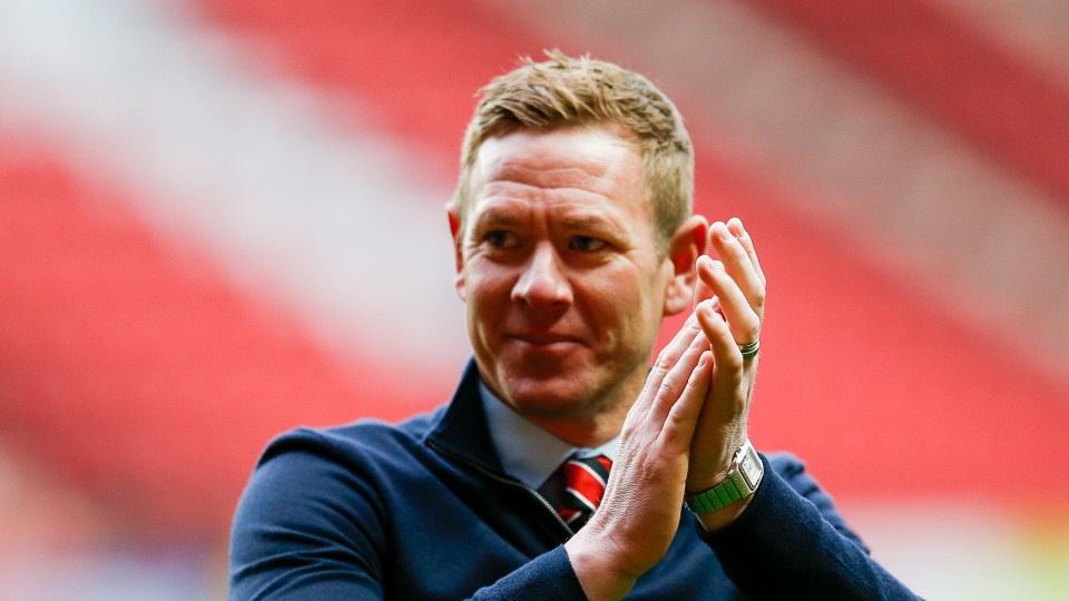 Dean Holden claps supporters