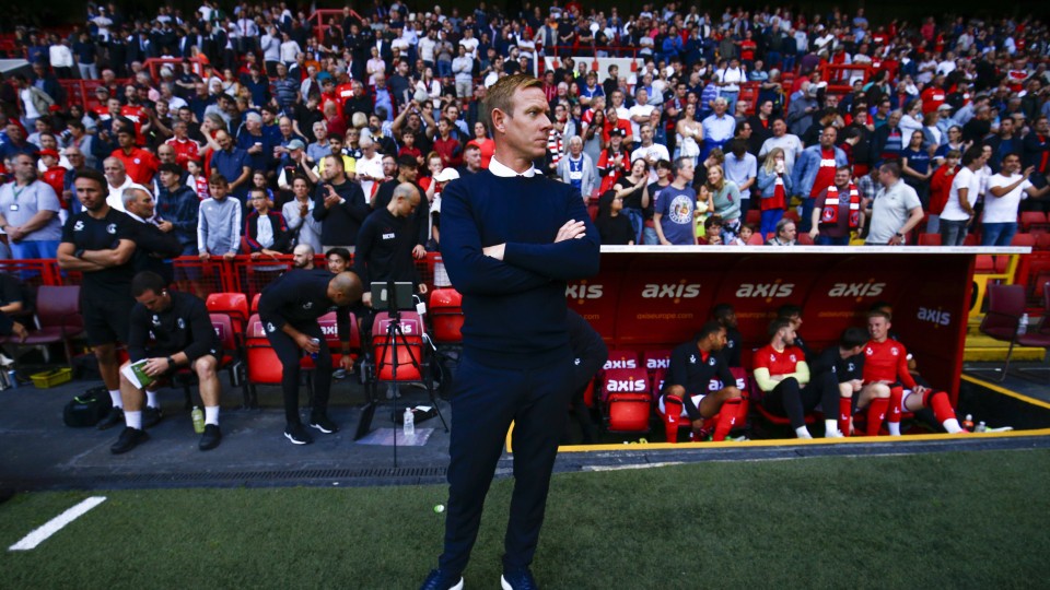 Dean Holden looks on