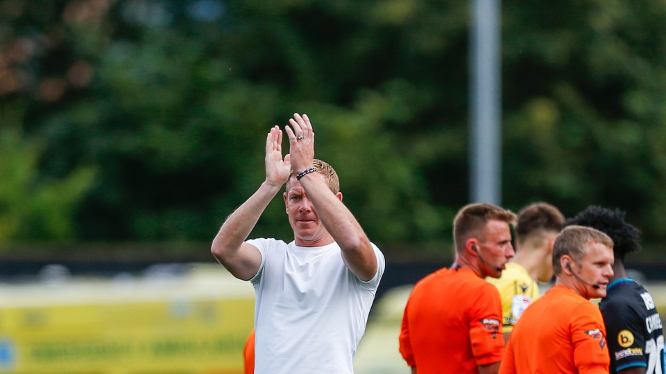 Dean Holden claps supporters