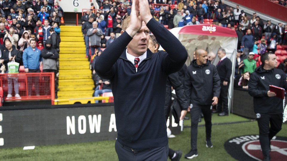 Dean Holden claps supporters