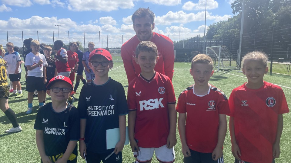 Scott Fraser posing with some young Charlton fans