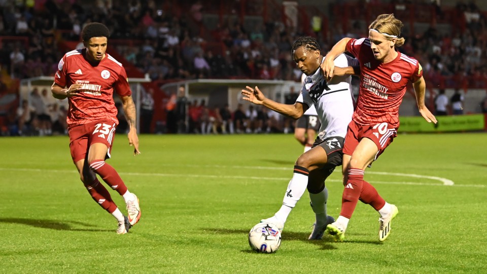Tayo Edun challenges for the ball