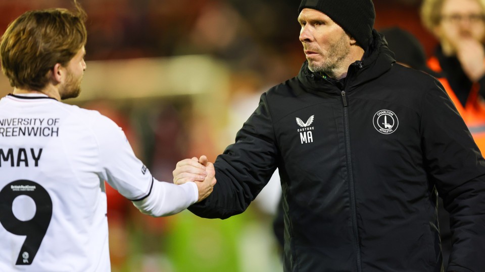 Michael Appleton shakes hands with Alfie May