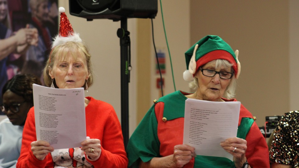 Extra Time participants singing carols
