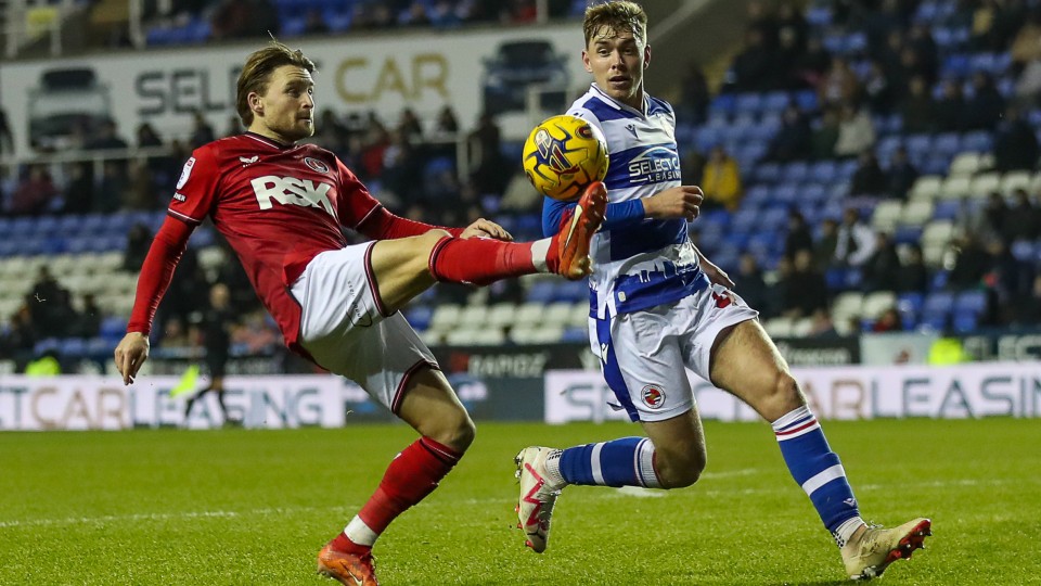 Alfie May battles for the ball