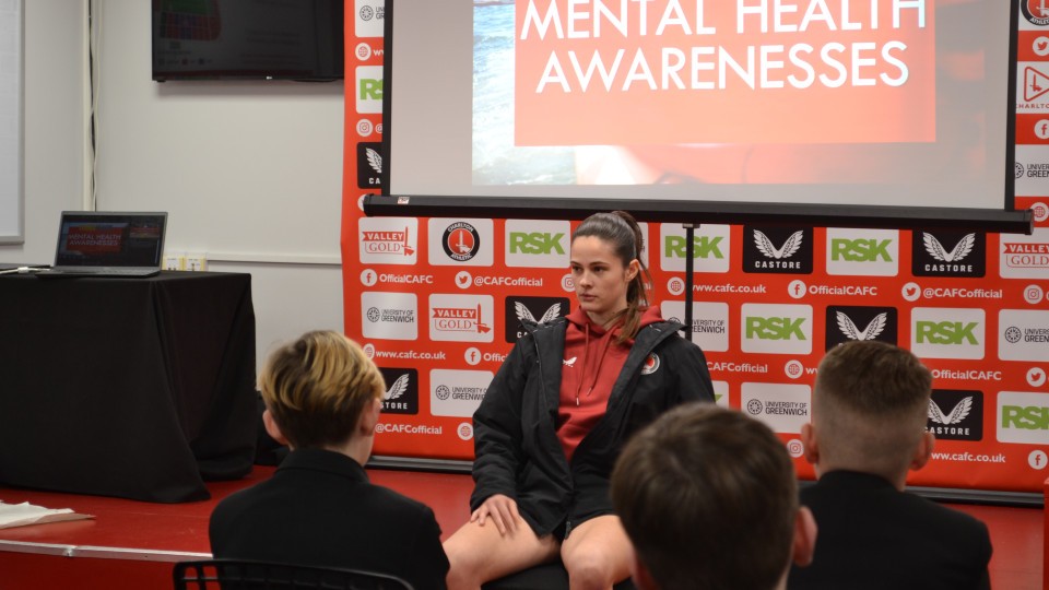 Freya Godfrey speaking at the front of a room