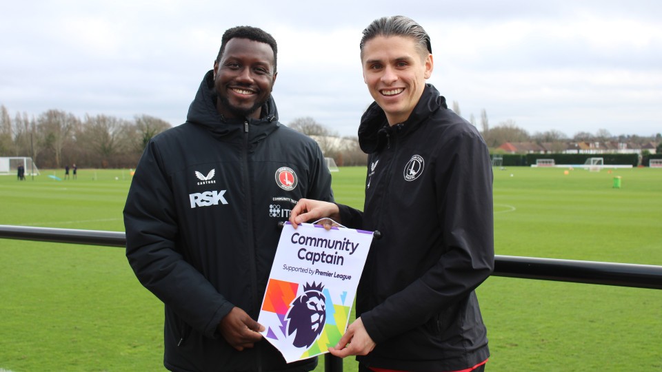 George Dobson presenting Anthony Quarm with a Premier League award