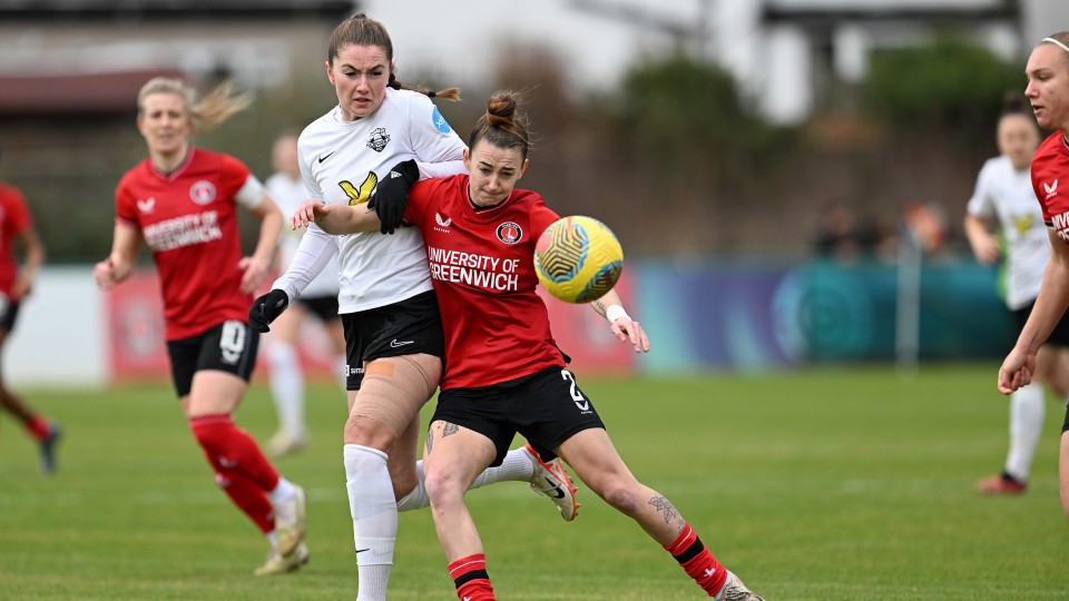 Rebecca McKenna challenges for the ball