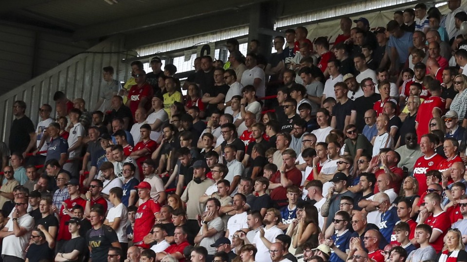 Fans in the Covered End watch on
