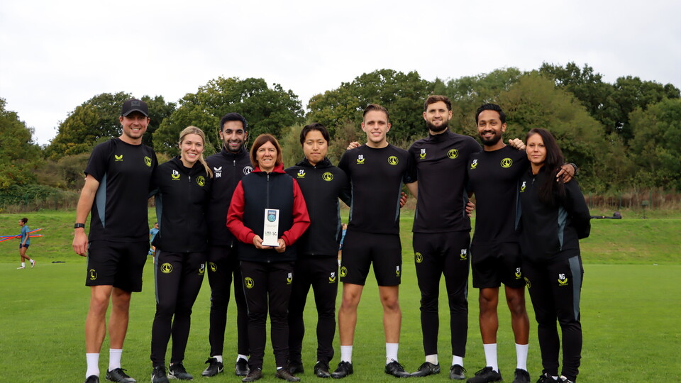 Karen and the squad with the MOTM trophy