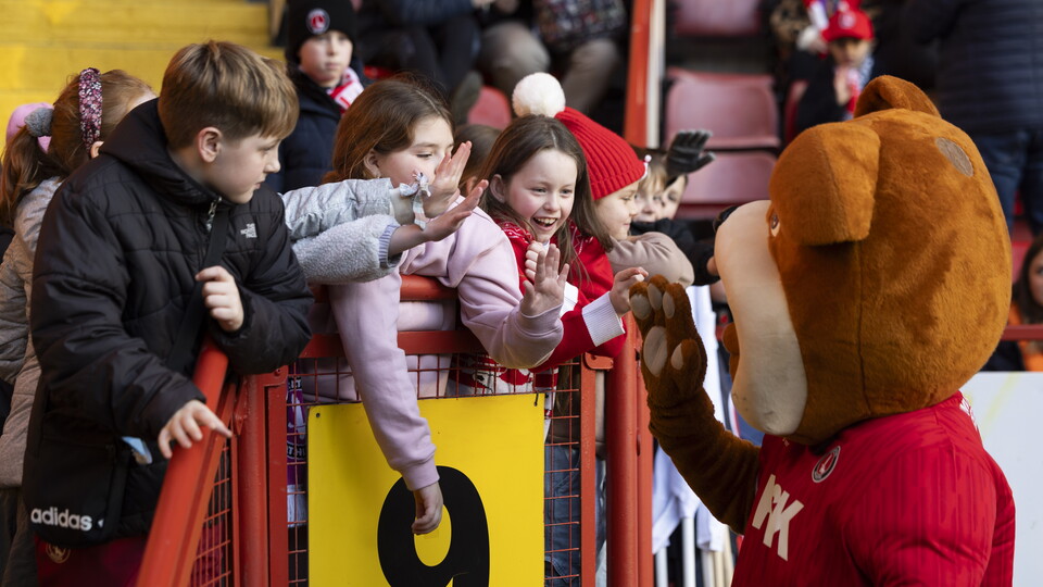 Charlton fans high five club mascot