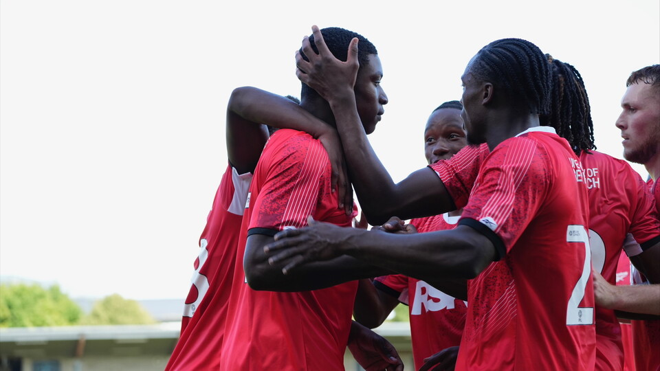 Micah Mbick celebrates