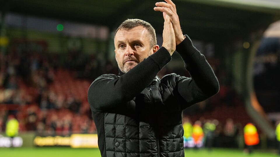 Nathan Jones claps supporters