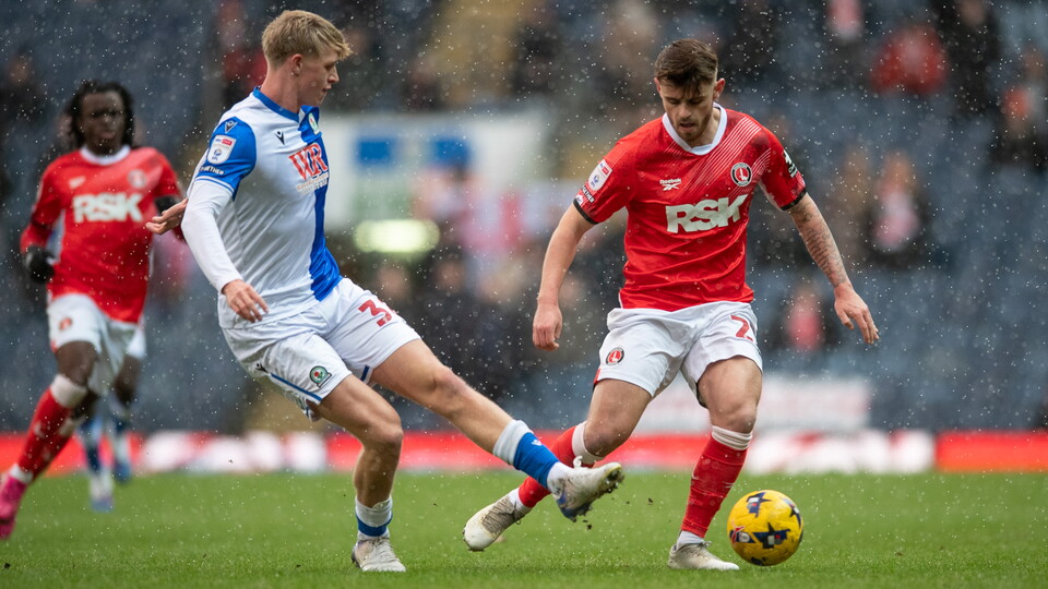 Charlie Kelman battles for the ball