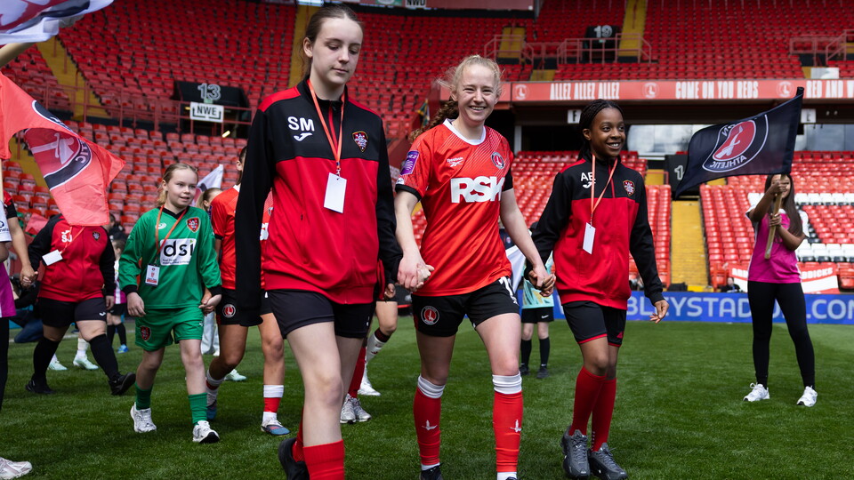 Lucy Fitzgerald walks out with her mascots vs Liverpool