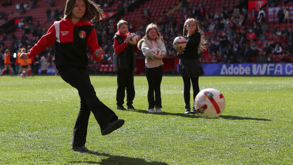 Fan taking a half-time penalty during the Liverpool match