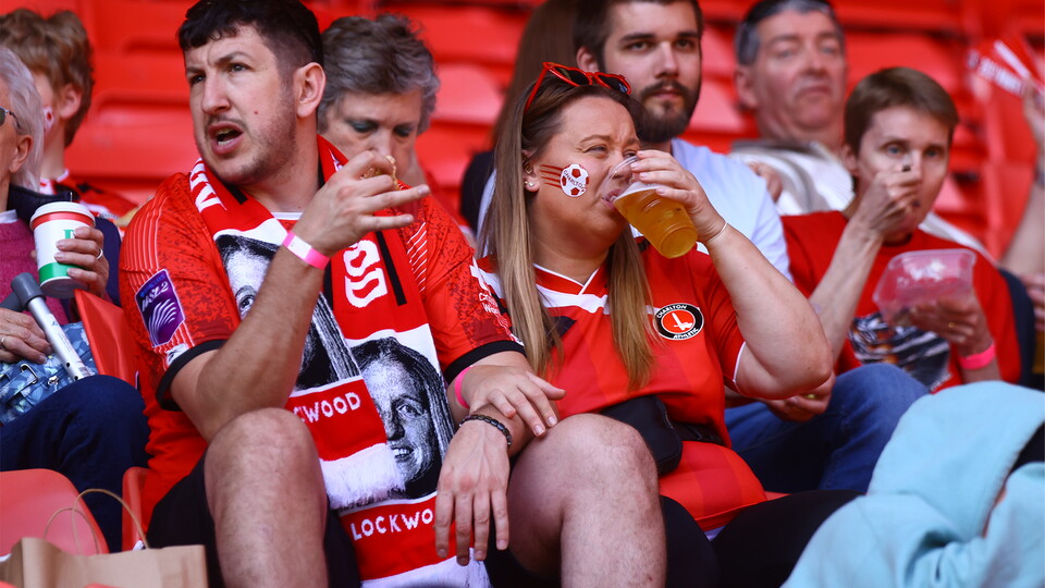 Fans drinking in the stands